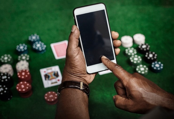 Android phone displaying kampung slot app home screen with sportsbook and casino sections